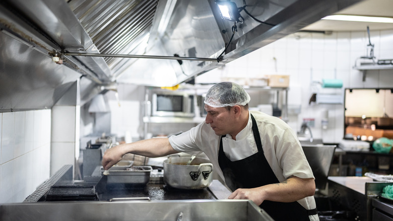 man working in commercial kitchen