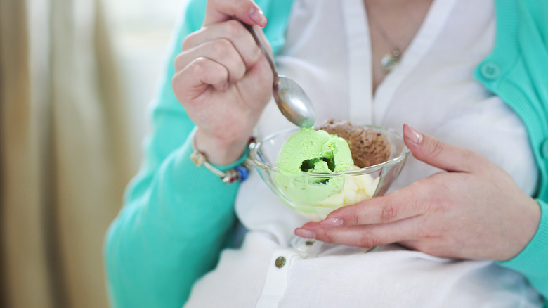 Pregnant woman eating ice cream