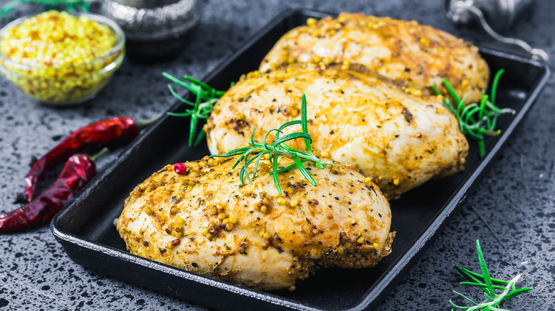 Tray of cooked chicken breasts