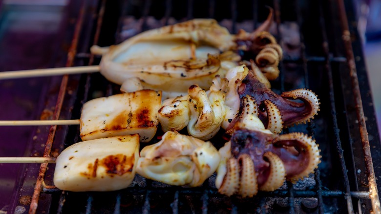 octopus skewers on a grill