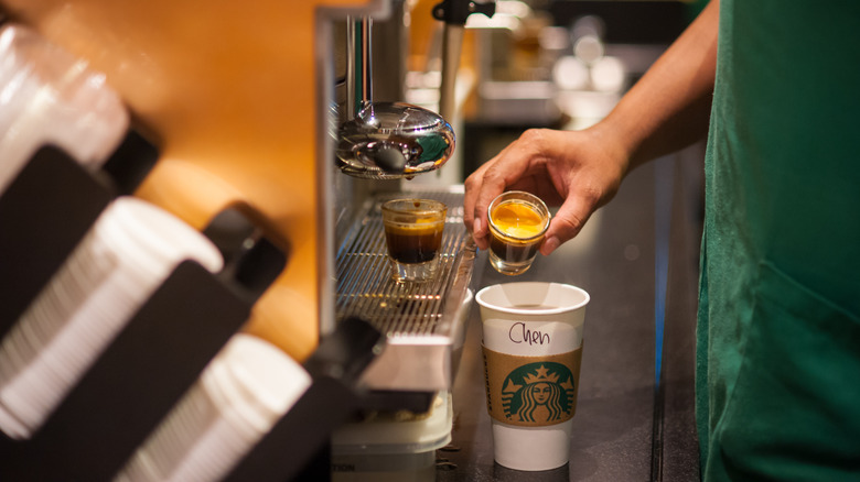 Starbucks barista making a drink