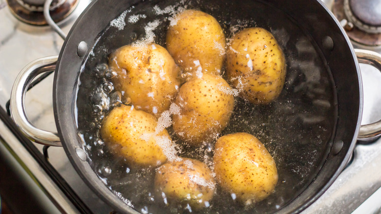 potatoes boiling in a large pot 