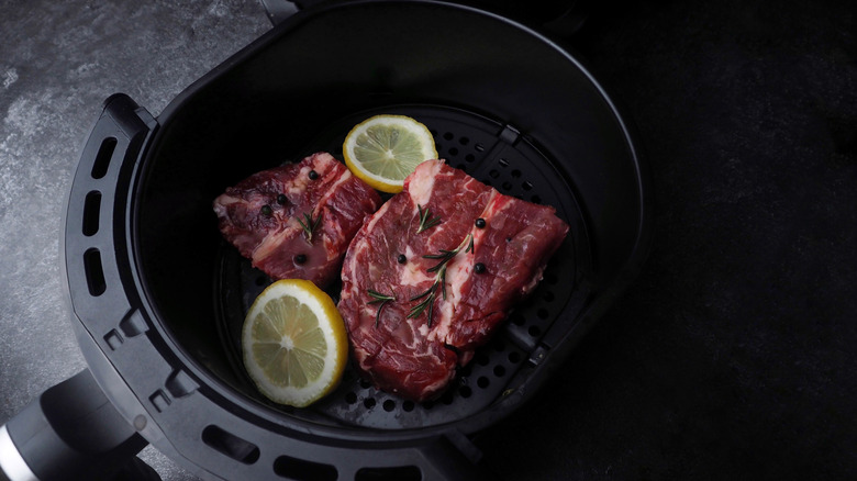 Steak in an air fryer basket