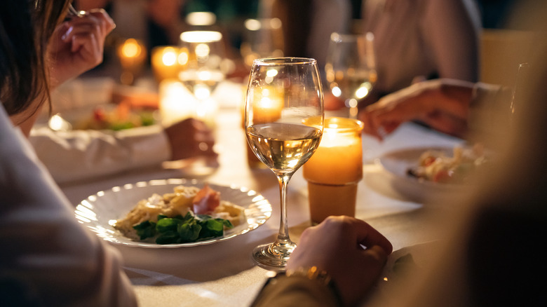 People eating dinner at table