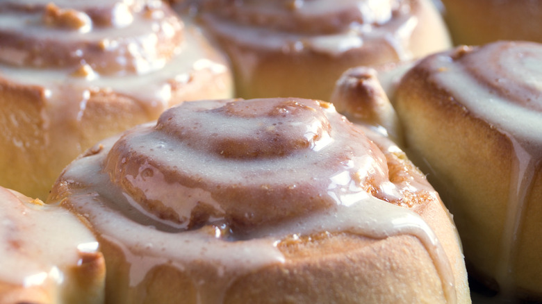 Cinnabon glaze on cinnamon rolls