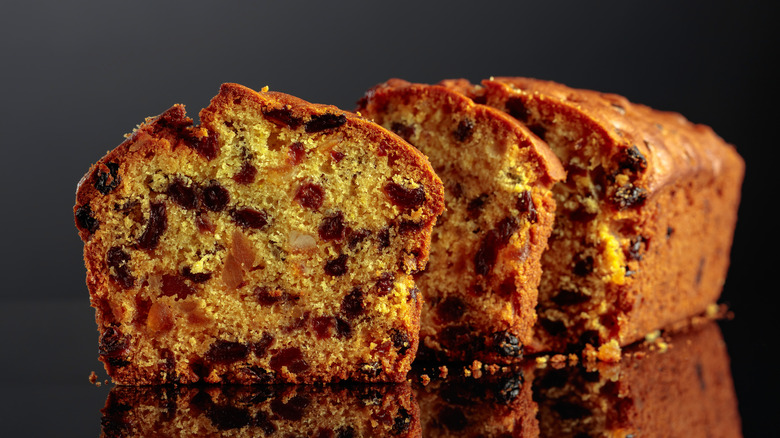 Slices of fruit cake with raisins, currants, and nuts.