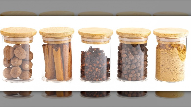 nutmeg, cinnamon, cloves, allspice, and ginger in separate jars