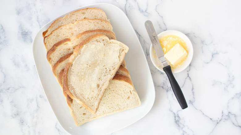 buttered bread slices on plate