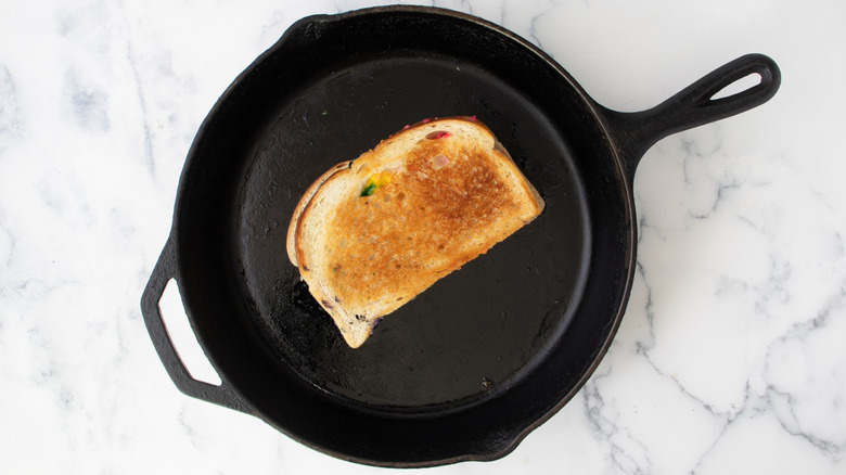 browned grilled cheese in skillet