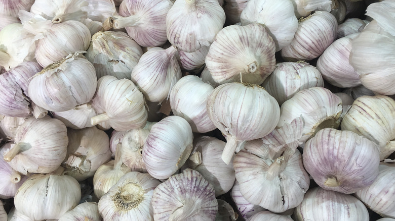 White garlic bulbs in a basket