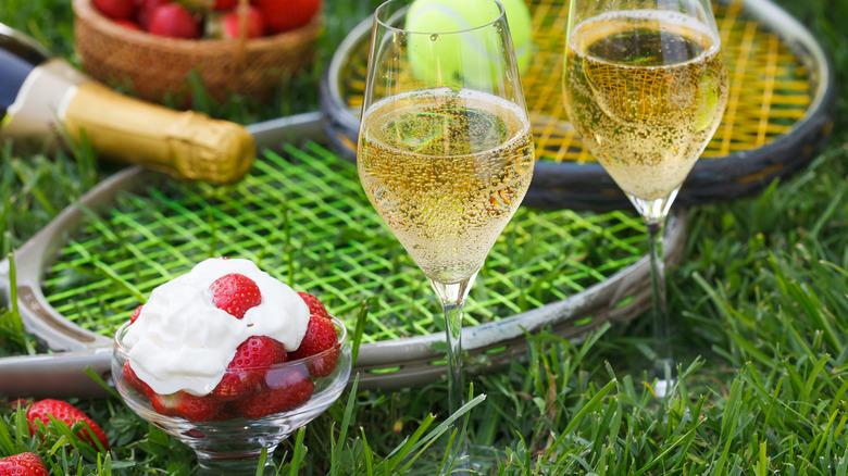 Wimbledon tennis rackets, champagne, and strawberries and cream