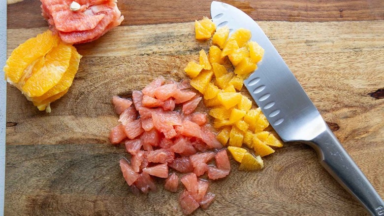 diced orange and grapefruit on wood cutting board