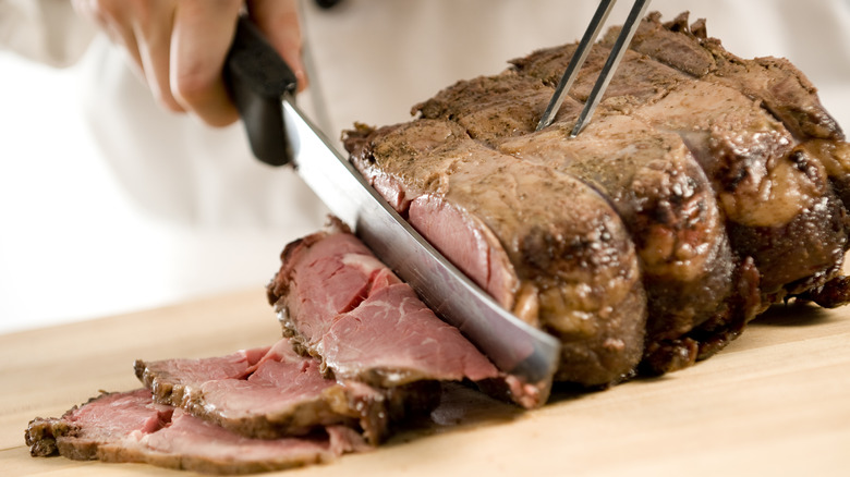 Person cuts steak