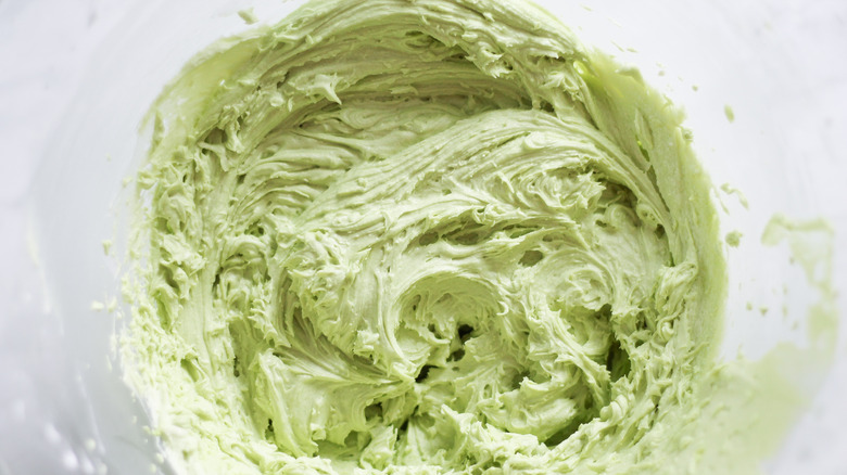 green buttercream icing in bowl