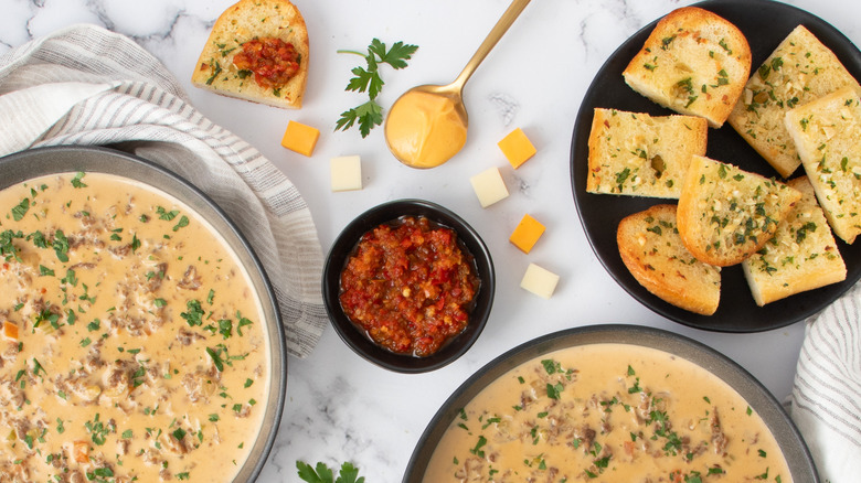 bowls of soup with bread