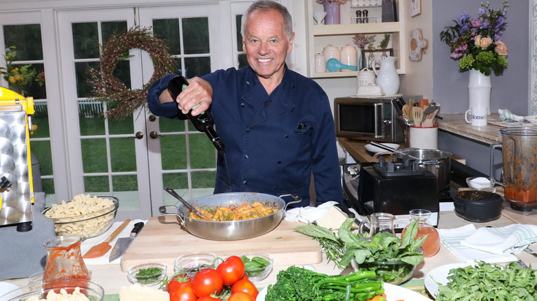 Wolfgang adding olive oil to pan