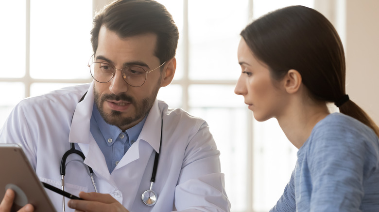 doctor reviewing notes with patient