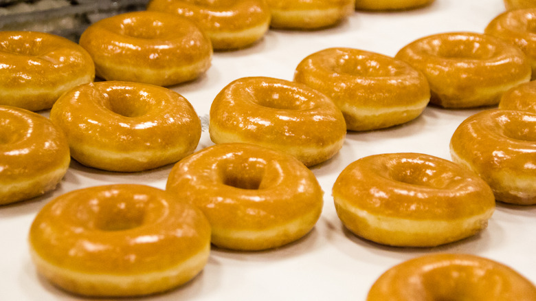 Glazed donuts lined up at Dunkin