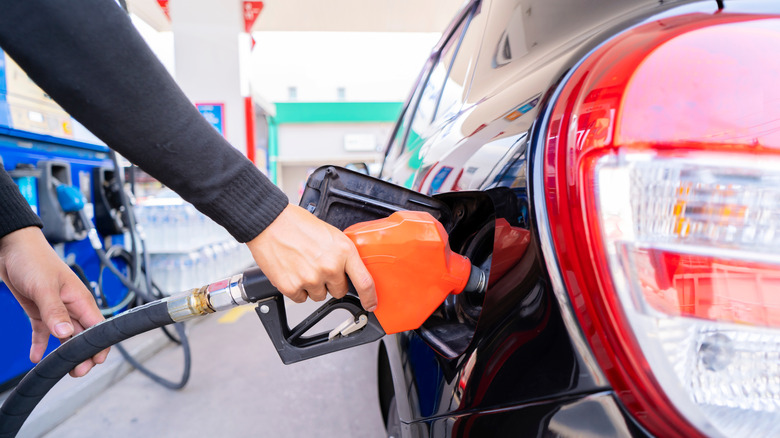 Person pumping gas