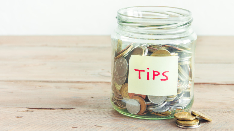 Tip jar with coins inside