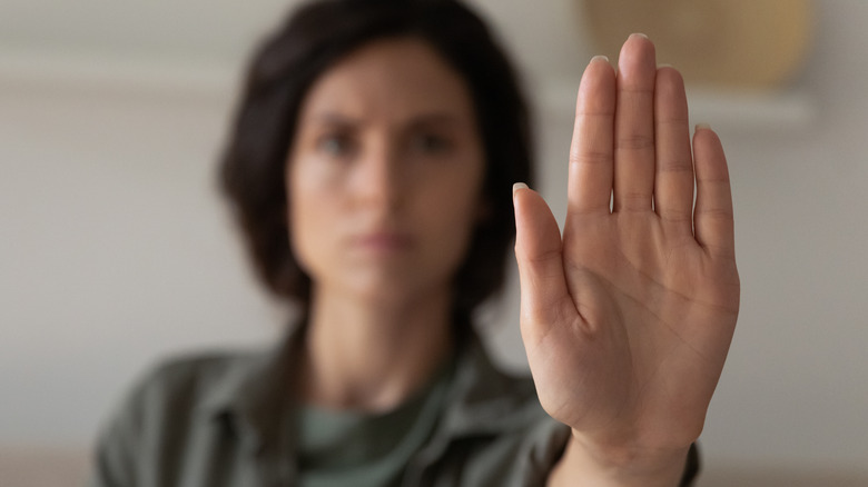 woman showing palm of hand