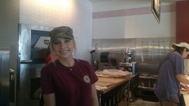 Smiling MOD Pizza employee