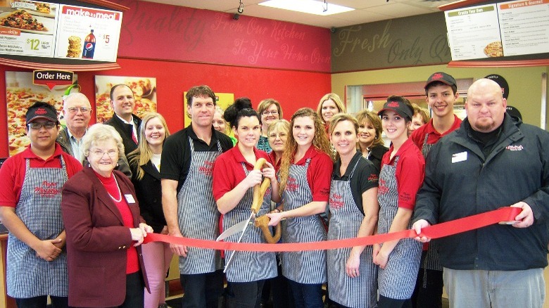 A bunch of employees in uniform at Papa Murphy's.