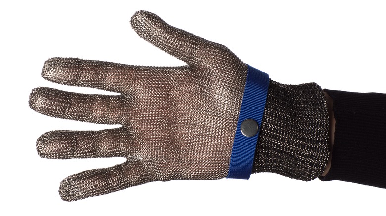 Hand in chain mail glove