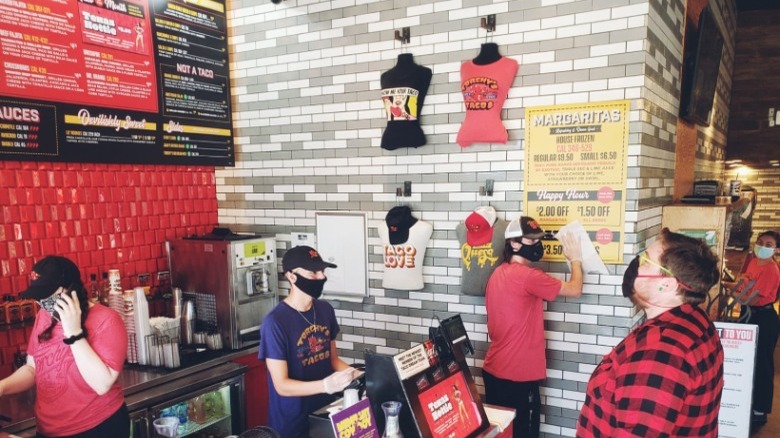 Employees working at Torchy's Tacos