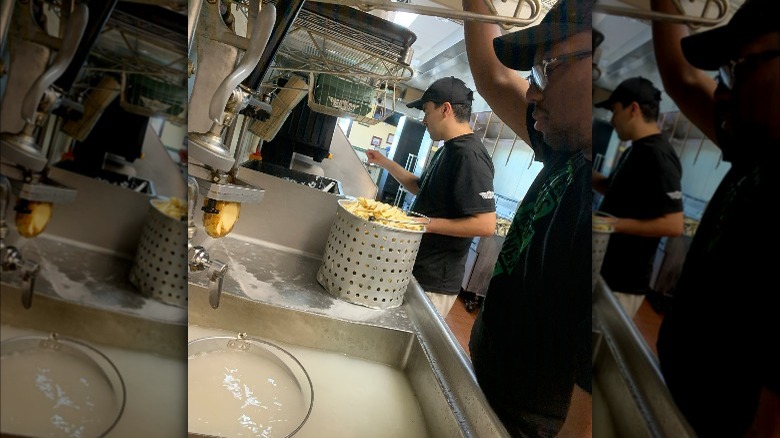 Wingstop employees working behind counter