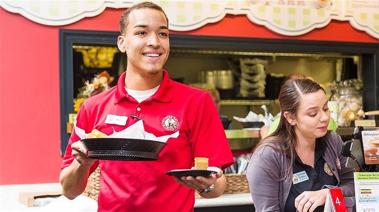 chicken salad chick employees smiling and serving food