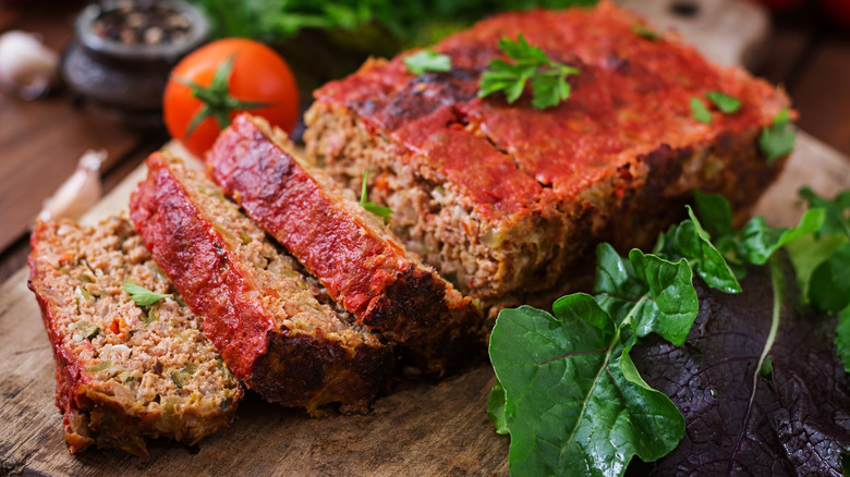 moist homemade meatloaf on a rustic wood board