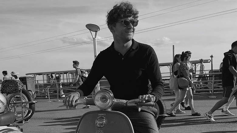 Nathan Cripps smiling on motorbike