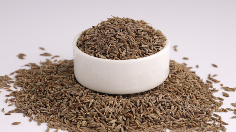 Cumin seeds in white bowl