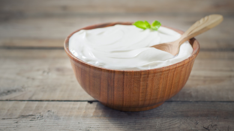 Greek yogurt in a wooden bowl