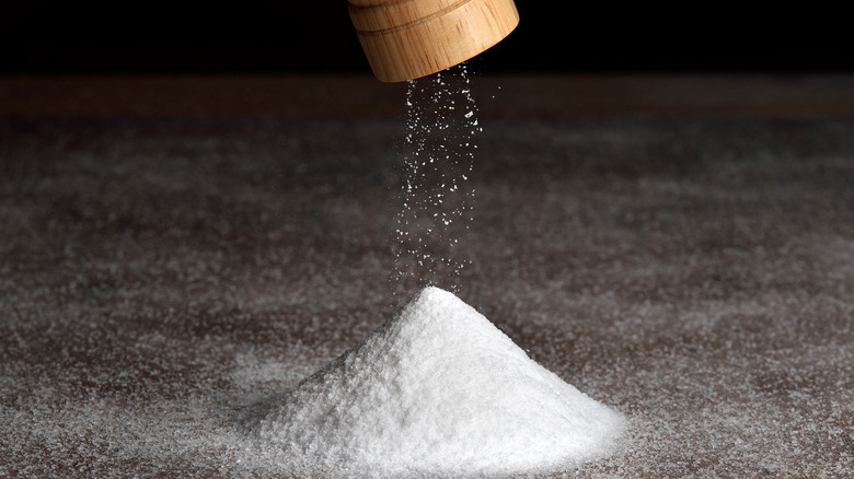 Mound of salt poured from shaker