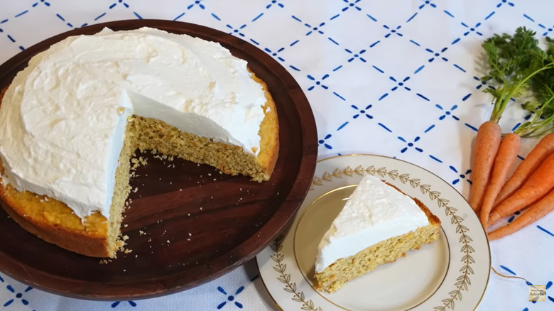 Carrot cake with slice on plate