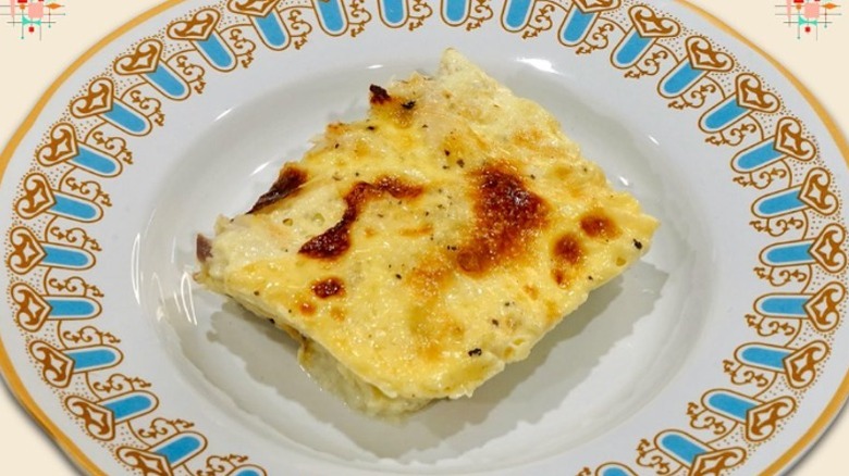 Square of fish pudding on plate