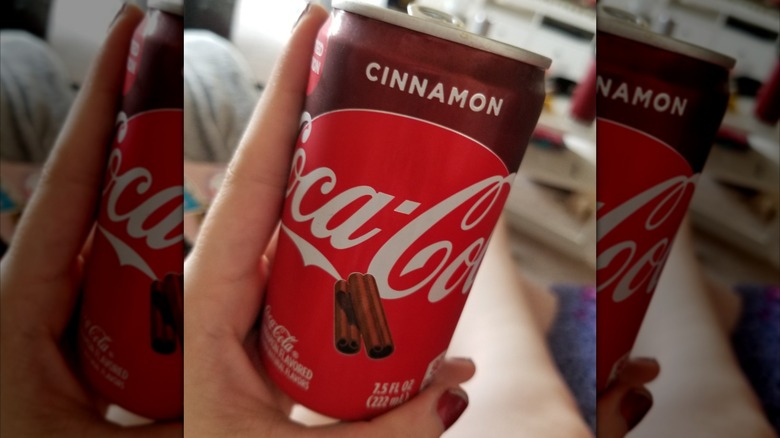 Handheld can of Cinnamon Coke