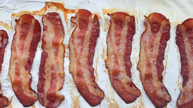 bacon slices on parchment paper