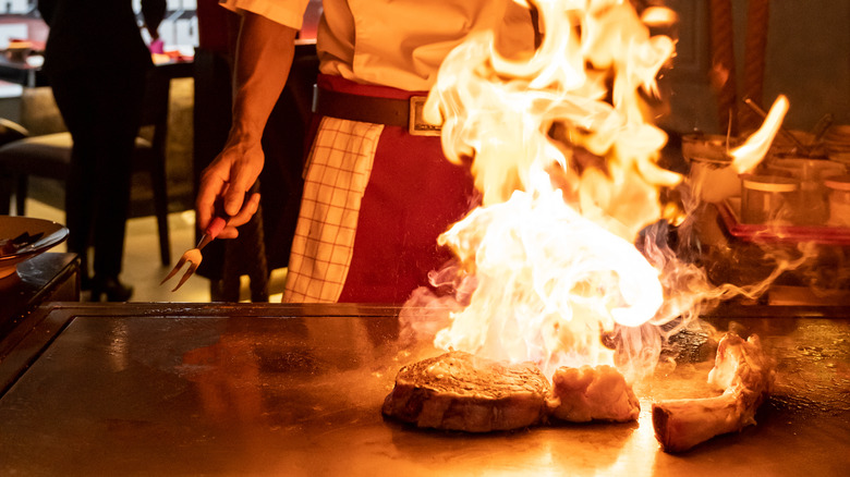 hibachi chef grilling steak