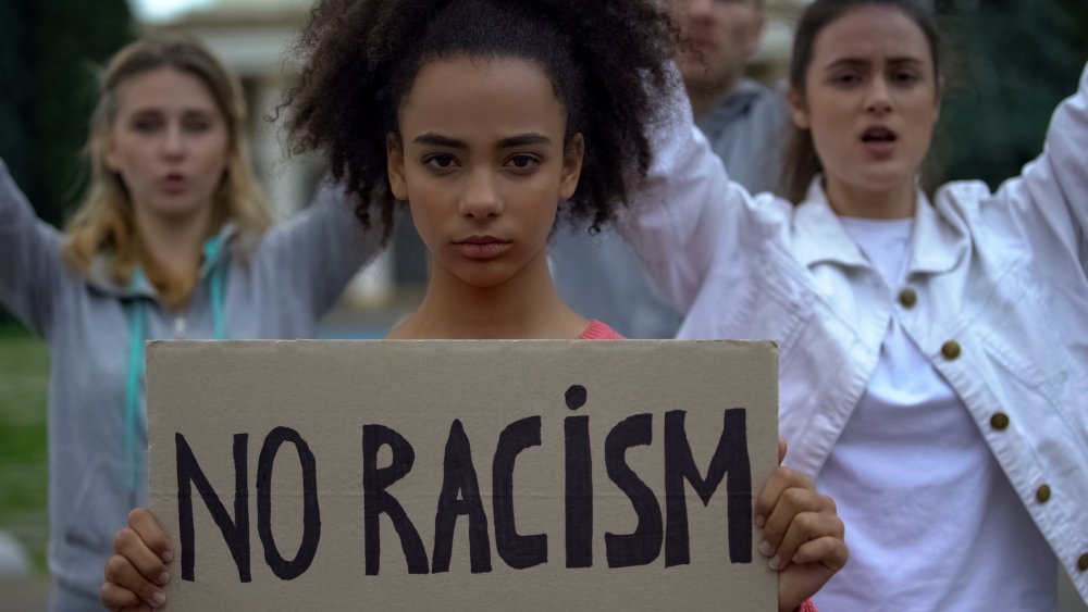 Woman holding sign