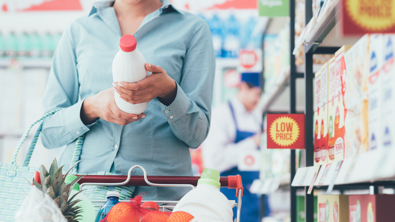 Woman inspecting a food label