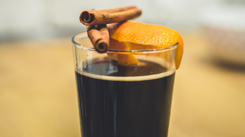 Mulled beer with cinnamon sticks