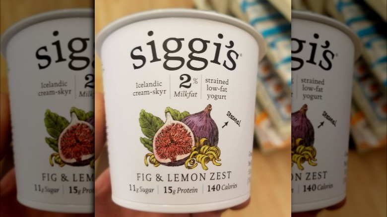 Person holding Siggi's Fig & Lemon Zest Yogurt