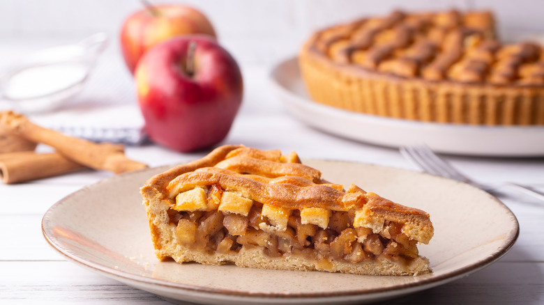 A cut slice of apple pie