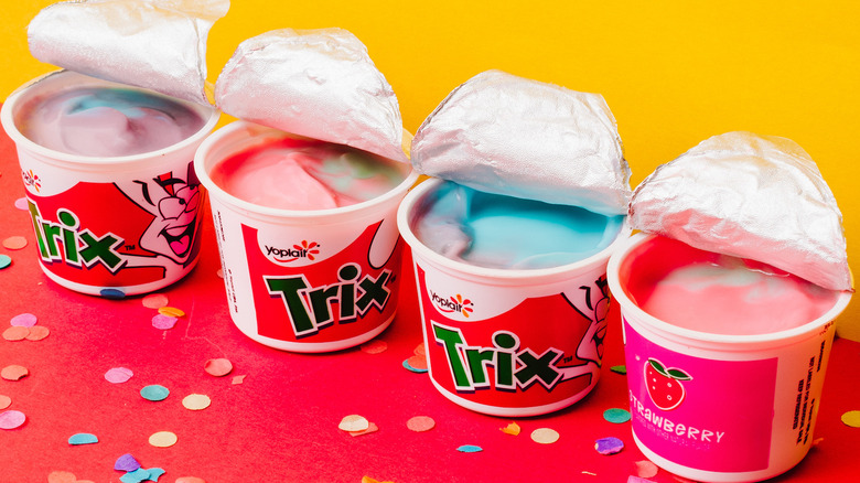 Four cups of colorful Trix yogurt with open lids