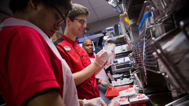 Chick-fil-A workers prepare food