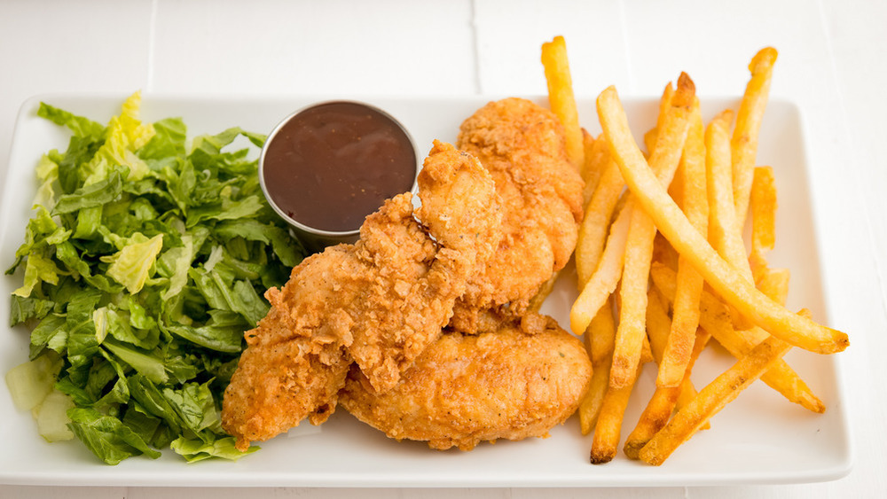 Chicken tenders and fries and sauce