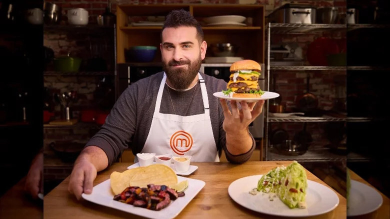 Michael Silverstein holding MasterChef Table dishes